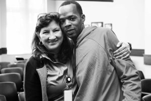 Maria Murillo hugs a returning citizen during a second chance event in Florida.